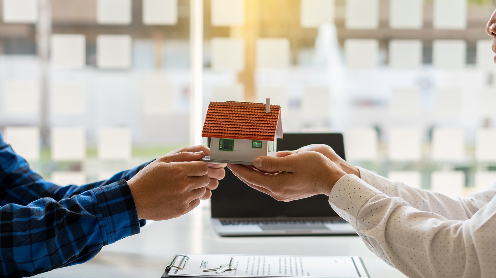 Two people holding a house to promote Renters’ Rights Act 2025