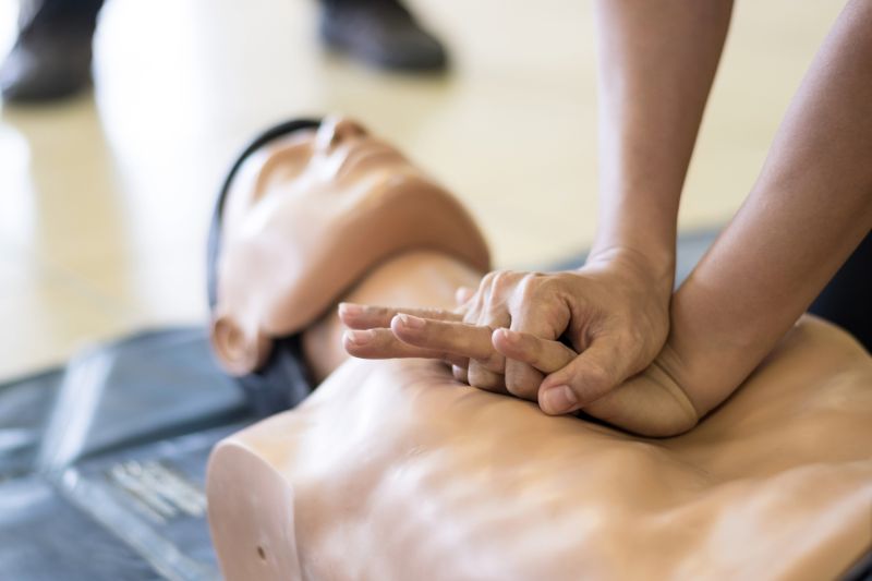 Hands on a dummy performing CPR