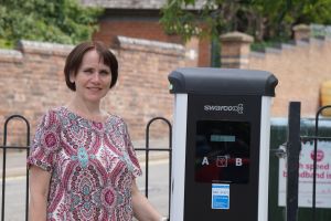 Cllr Zoe Cookson with one of the new EV charges in Tallow Hill car park