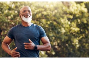 Man running through woodland