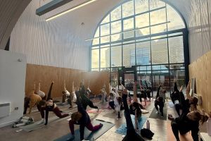 An exercise class taking place in a converted railway arch