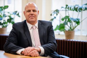 Lloyd Griffiths sitting in a council office