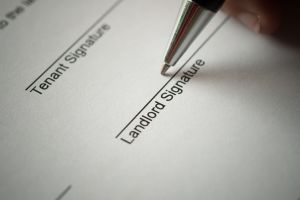 A document with spaces for the signatures of a tenant and a landlord