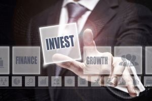 A person pointing at an invest block
