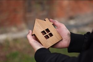 A jigsaw of a house with a piece missing