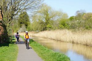People cycling and walking on the canal footpath