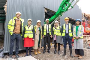Standing outside the building are (l-r): George Hall; Councillor Lynn Denham; Gemma Parsons; Councillor Jabba Riaz; Bridget Brickley; David Sutton; Claire Miller.