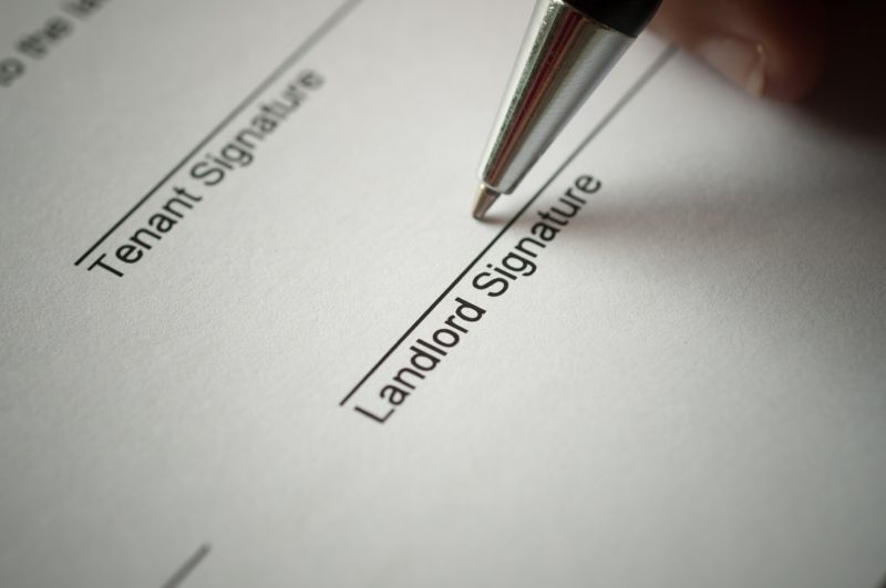 A document with spaces for the signatures of a tenant and a landlord