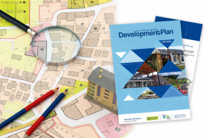 A copy of the South Worcestershire Development Plan lying on top of a map